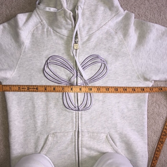 Very light grey TNA zip up with light purple logo - Picture 9 of 11